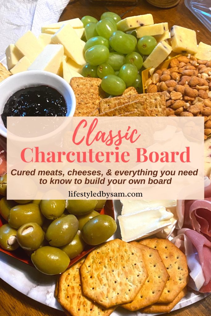 Pinterest pin for a classic charcuterie board post - close up image