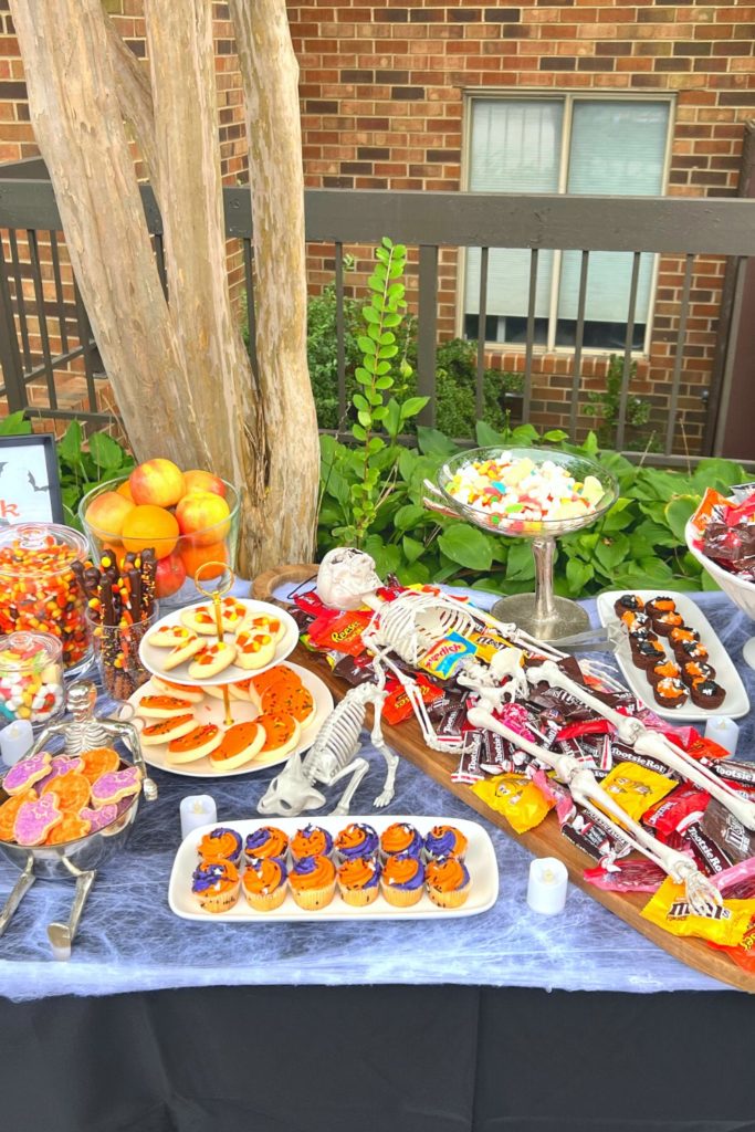 Trick Or Treat Table With Candy, Baked Goods, Healthy Snacks, and More.