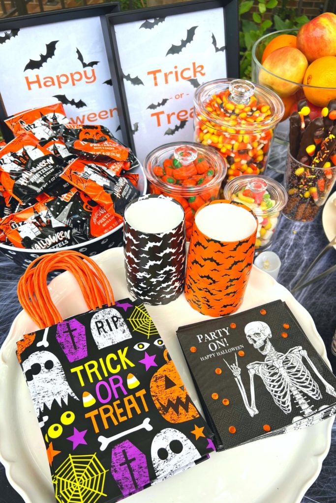 Halloween good bags and napkins on a cake stand