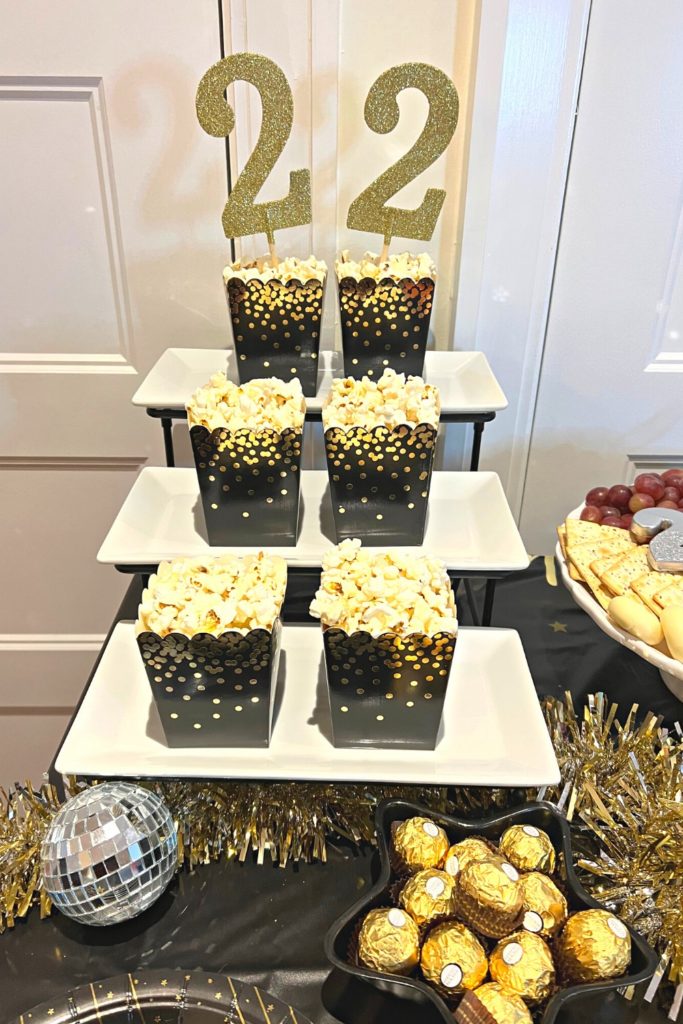 Three tiered tray with single servings of popcorn