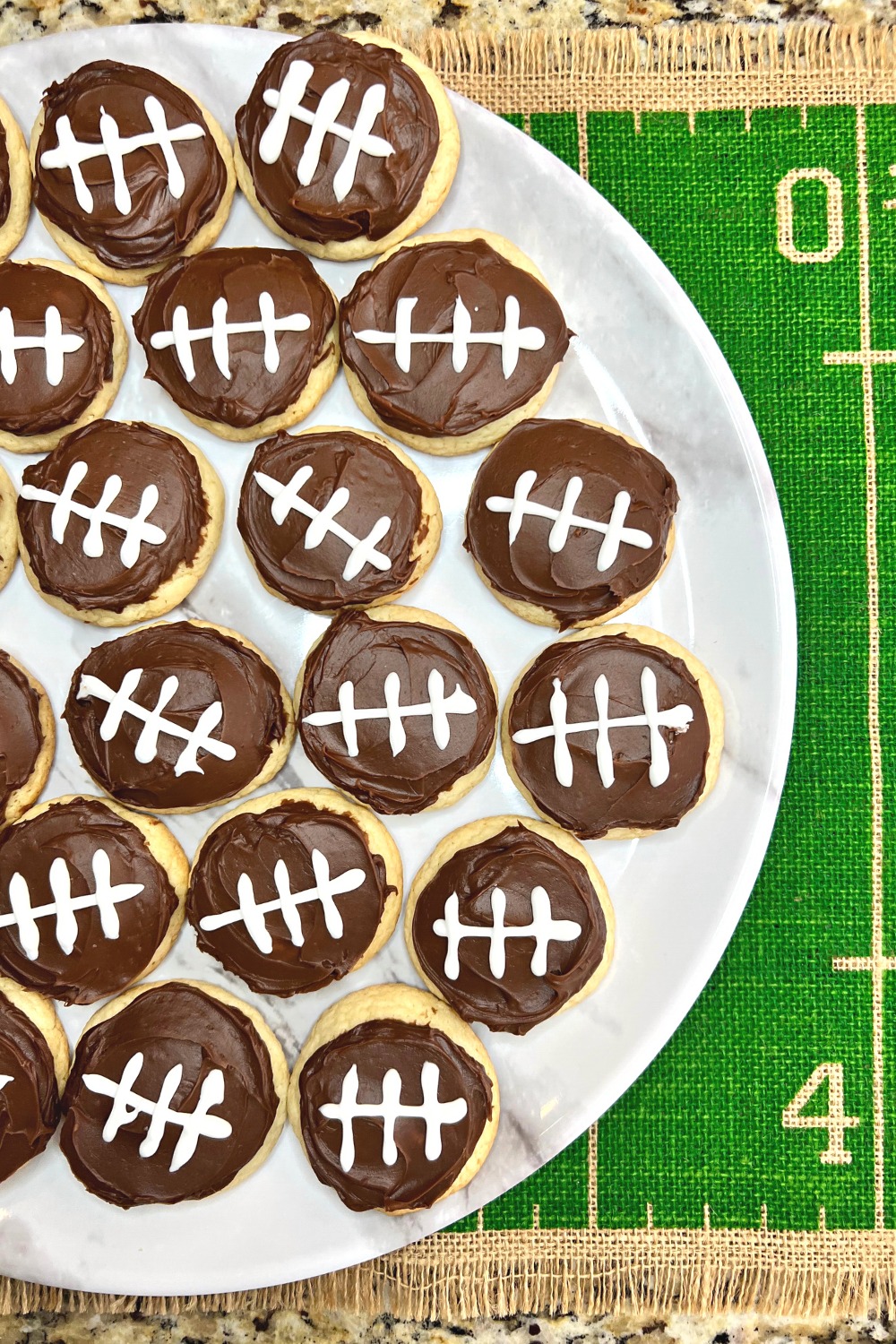 Image of half of a plate arranged with football cookies
